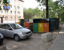 На улице Попова заменят контейнерную площадку на парковку